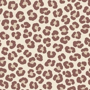 Playful leopard print, brown spots on cream white