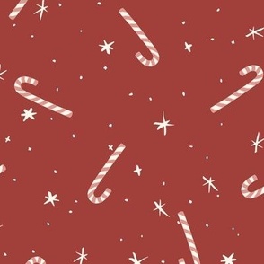 Hand drawn tossed festive christmas candy canes and stars in cardianal red