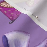 Purple mushrooms and bows on grape background