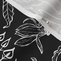 Large scale elephant, peacock and magnolia modern classic Indian Floral  in white on black ground. 