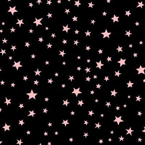 Scattered pink Halloween stars on black