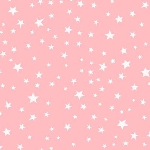 Scattered white Halloween stars on pink
