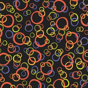 Festive Party Rings Tossed in Orange, Lime, and Periwinkle on Black