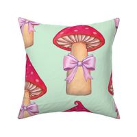 Red mushroom with pink bows on mint green background