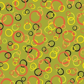 Festive Party Rings Tossed in Orange, Yellow, and Black on Green