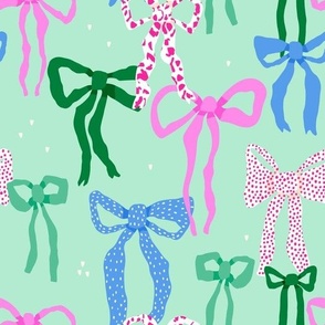 Colorful bows on mint