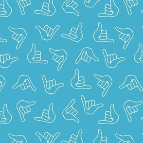 Colorful Aloho shaka surf - salty sea ocean greetings hang loose sign hand gesture white on aqua blue 