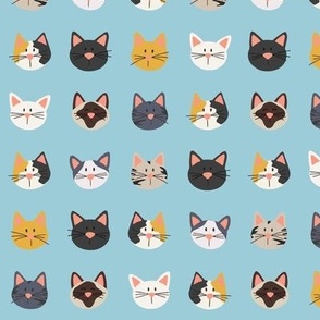 Cute Cat Faces on Blue