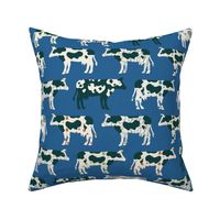 Cows, cows, cows on bright blue - large