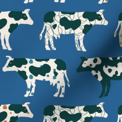 Cows, cows, cows on bright blue - large