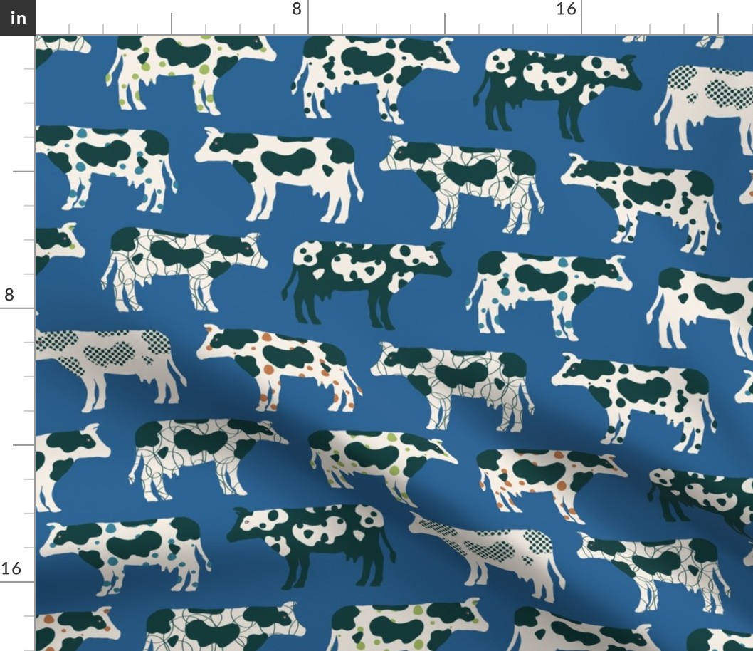 Cows, cows, cows on bright blue - large