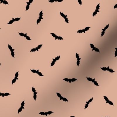 Small black Halloween bats on tan brown