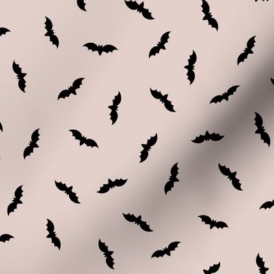 Small black Halloween bats on grey