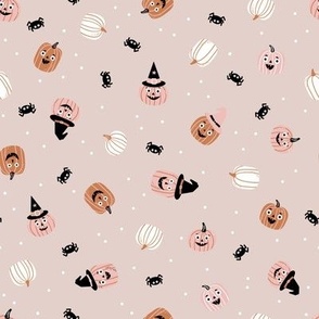 Cute Halloween pumpkins and spiders on warm grey