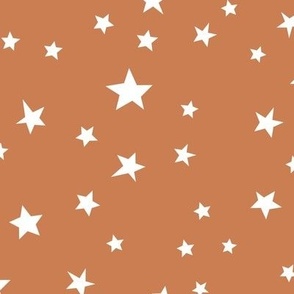 Scattered Boho stars in ochre brown and white