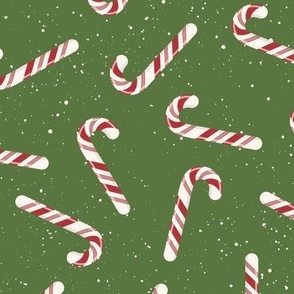 S ✹ Festive Red and White Peppermint Candy Canes on a Green Background