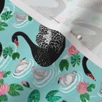 waterlilies and black mother swans with their babies on tropical blue at Spoonflower
