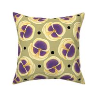 Yellow pansy  with black polka dots on khaki background 