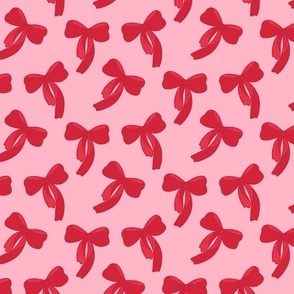 Red bows tossed on pink background Medium