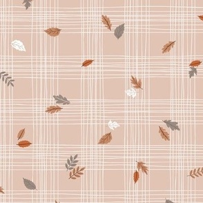 Hand drawn white and muted pink grid with scattered colorful fall leaves 