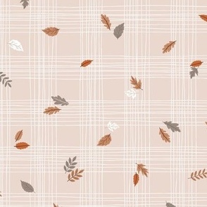 Hand drawn white and pink grid with scattered colorful fall leaves 