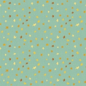4” repeat tiny gold, bronze and yellow effect scattered, tossed non directional stars, blender for afternoon tea On celadon green