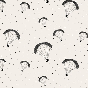 Parasails, the joy and excitement of paragliding over the sky, black & white