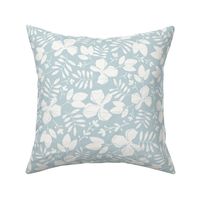 Small Scattered and Textured Tropical Blossoms and Leaves in cream on light denim blue