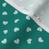 Small-White Cutout Hearts on turquoise