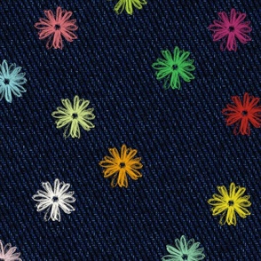 embroidered denim - blue jeans and faux embroidered flowers - stitched flower on dark blue jeans
