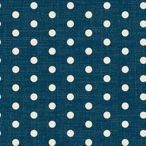 Medium scale  beige polka dots on a dark textured denim blue.