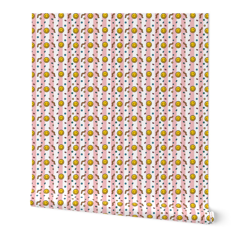 Pop art happy emoji in baby pink stripes background