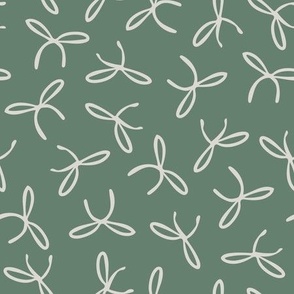 Freehand bows in polka dot style design - beige on dusty green background