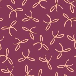 Freehand bows in polka dot style design - salmon orange on dark raspberry pink background