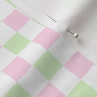 Painted checkerboard pattern with paint stroke checkers in pastel green & pink