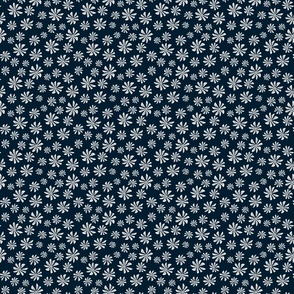 Small retro floral pattern. White flowers on a dark blue background.