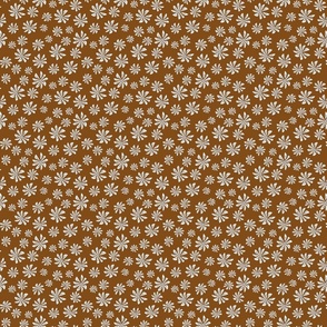 Small retro floral pattern. White flowers on a brown background.