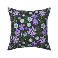 Blue, lilac flowers on a dark gray background. Retro floral pattern.