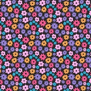 Tiny colorful daisies on black background. Extra small scale daises. Small scale colorful flowers. Ditsy Flowers pink, purple, blue, red, yellow on dark grey charcoal background.