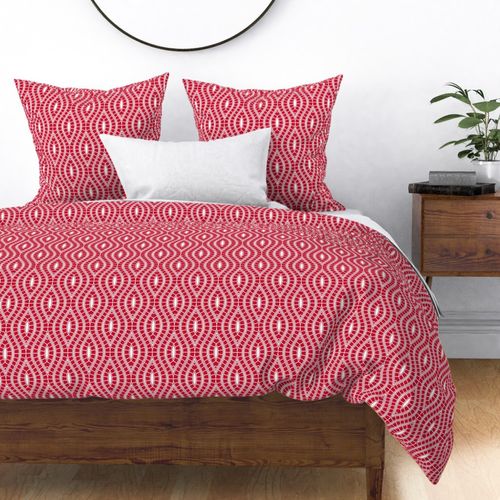 Red and white traditional geometric design with vertical wavy lines.