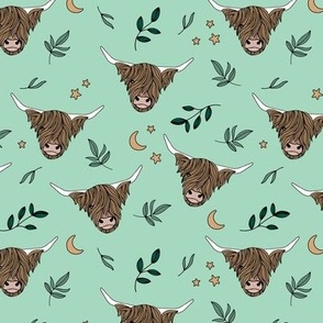 Little cute highland cows - night garden with moon stars and leaves boho animals on mint green