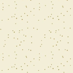 mini mustard stars scattered on cream background