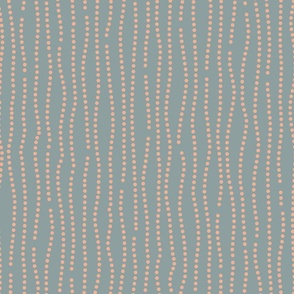 Vertical wavy lines of dots in a subtle nod to bubbles rising in peach on a sea green background