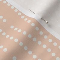 Vertical wavy lines of dots in a subtle nod to bubbles rising on a peachy orange background