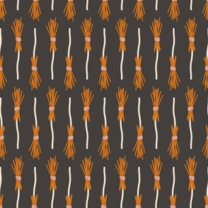 Witch broom vertical stripes magic orange broomstick on dark gray brown