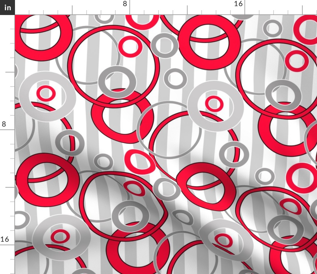 Red and gray rings on a striped gray and white background 