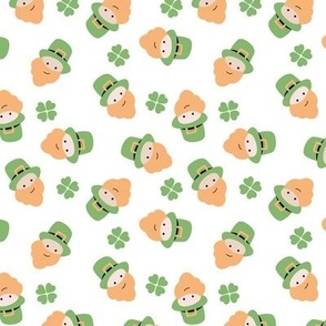 Cutesy leprechaun Irish St. Patrick's Day mascotte and shamrock green orange on white
