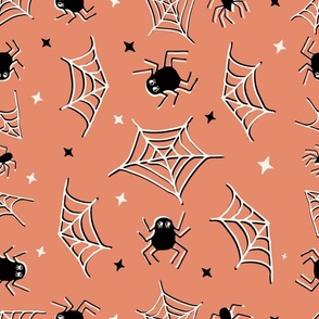 Cute Halloween Spiders and webs tossed in peach for quilting and kids - Large Scale