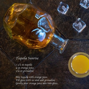 Tequila Sunrise On Slate Table With Recipe