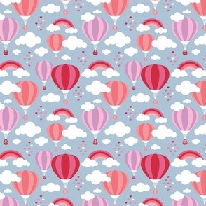 Hot air balloon and rainbows with clouds and hearts colorful kids design red pink on blue
